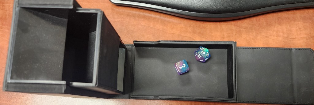 Dice rolling tower and the 2 dice used in this experiment (one 6 sided and 1 20 sided).