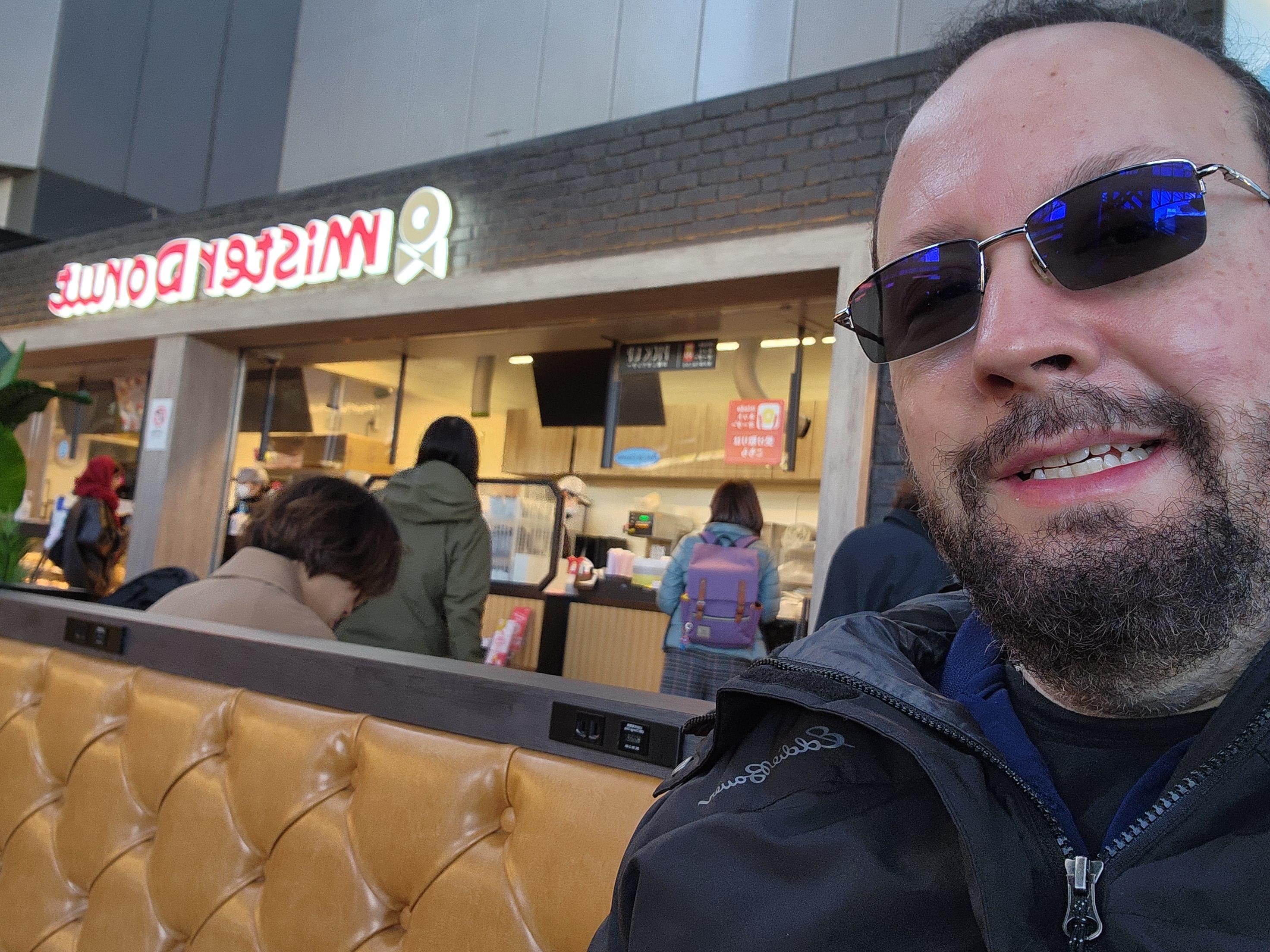 Stephen casual in Japan outside Mister Donut