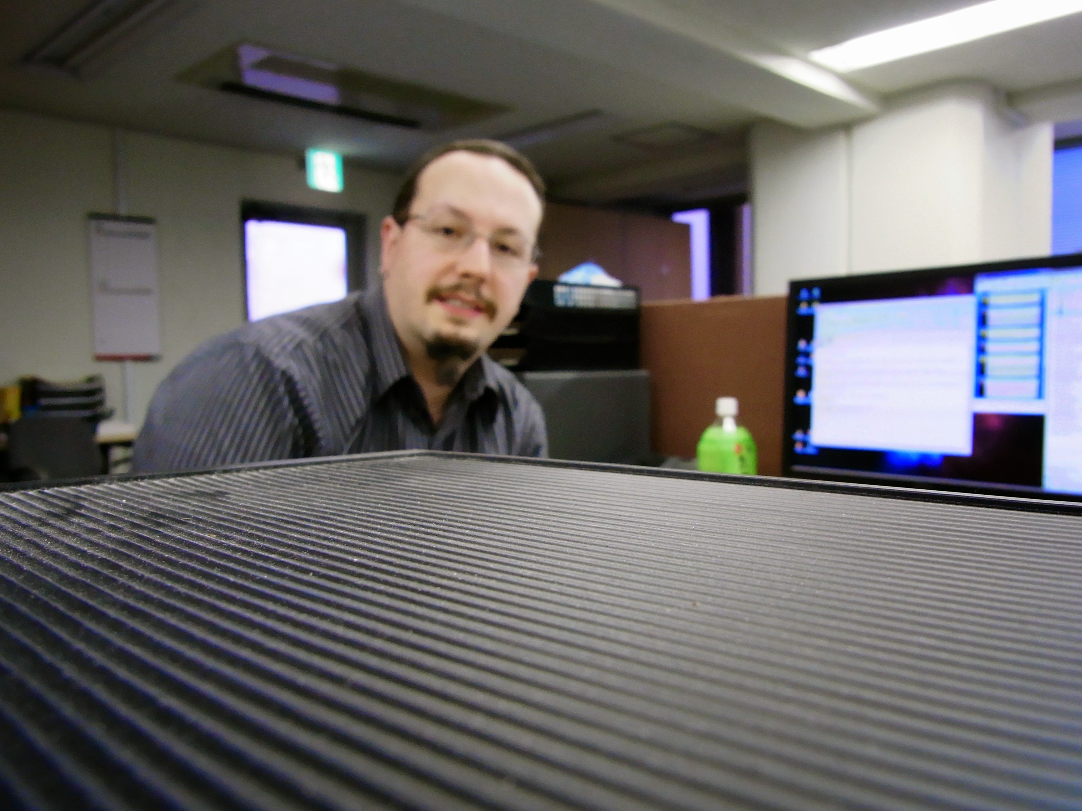 Stephen at his workstation with multiple monitors