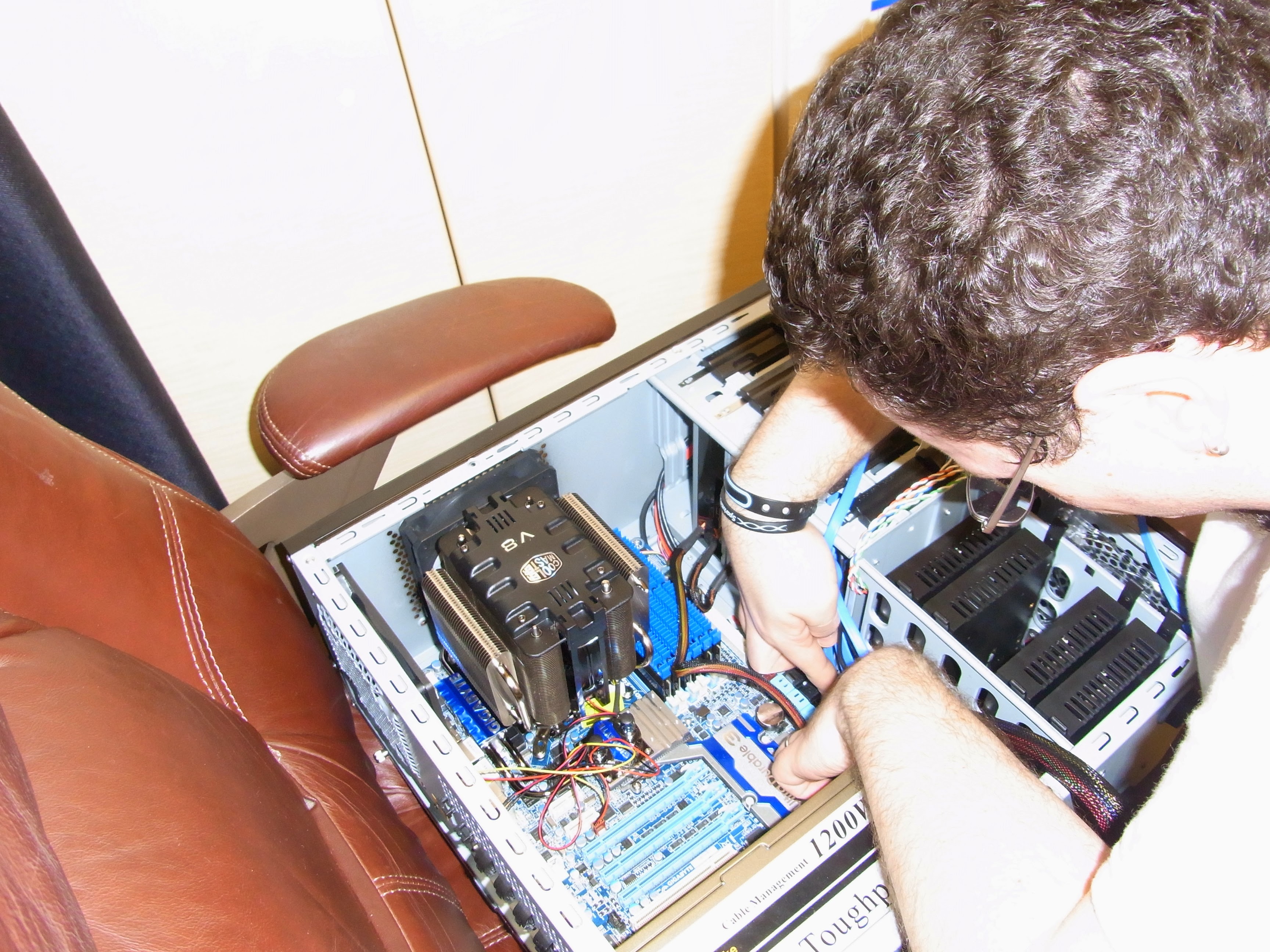 Stephen building a PC -hands deep in computer hardware